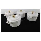 Four .5 Quart stoneware baking dishes with lids,