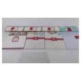 Four unopened packages of Christmas letterhead