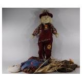 Scarecrow men, 1 is missing hat