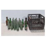 Soda bottles, mostly green Coca-Cola bottles,