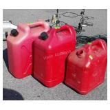3 Gasoline Containers, one missing cap, two 5