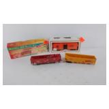 Three HO scale train cars