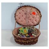 Seamstress basket with sewing supplies, needles,