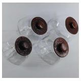 Set of 4 glass canisters with wood lids