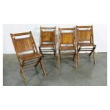Four wooden folding chairs