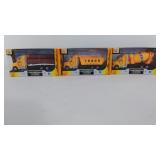 Three toy construction trucks, Totally Cool Toys,