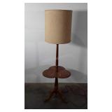 Wooden floor lamp with table, shade shows wear,