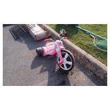 Radio Flyer Big Wheel, pink in color