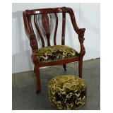 Ladies library armchair on wheels, carved faces