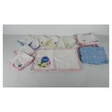 Embroidered place mats and napkins, some need