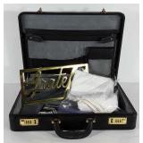 Leather briefcase, linen napkins and a brass