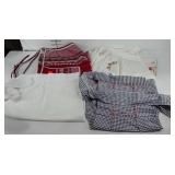 Four aprons, one with embroidered flowers