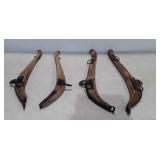 Two wooden horse collars