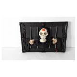 Halloween decor, skeleton behind bars battery