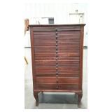 Sheet music cabinet, 16 drawers, one back leg is