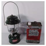 Coleman oil Lantern and gallon can of fuel,