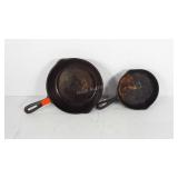Two cast iron skillets, show wear, 8" and 6"