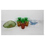 Colored glass group, green bases, blue bowl,