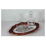Mirrored tray with glass decanter and condiment