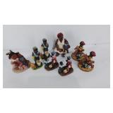 Group of 8 African American figurines made out of