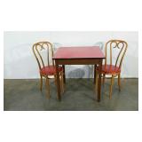Formica topped table and two cafe style chairs,