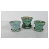 Three McCoy pottery planters, all have quilted