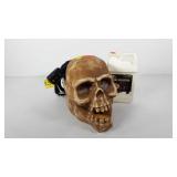 Skull design fog machine with solution, powers on