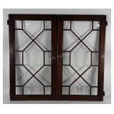 Pair of decorative hinged windows with wooden