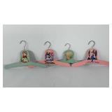 Four wooden clothing hangers for baby clothing,