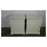 Two white laminate end tables, finish damage,