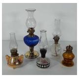 Five small glass oil lamps, includes brass and