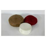 Three hats-red beret, suede cap, white pillbox
