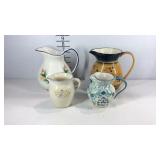 Four water pitchers