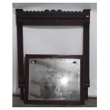Beveled mirror with frame, frame has flower