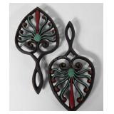 Two cast iron trivets