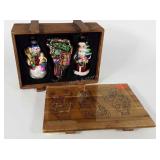 Three large glass Christmas ornaments in crate