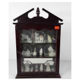 Curio cabinet filled with spun glass ornaments