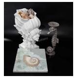 Beach themed decor, shells in larger shell,