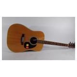 Takamine and Co. Guitar, missing a string, has a