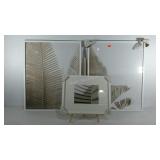 Three art prints, simple plant designs, larger