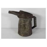 Oil can, 9" tall, has a dent