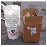 Four plastic buckets and a box of bucket lids