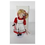 Porcelain doll on stand with working music box by