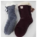 Two pairs of new non-slip socks, one still has