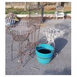 Three plant stands and a plastic flower pot