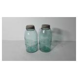 Two Mason jars with zinc lids and milk glass