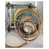 Embroidery hoops assorted sizes and a cross