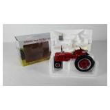 Farmall Super C die cast tractor by Ertl,  new in