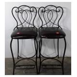 Two high backed wrought iron bar stools with