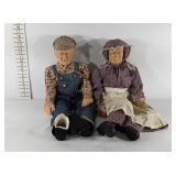 Elderly couple ceramic dolls, one with broken